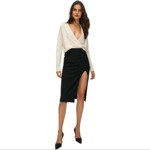 Babaton
Pencil Slit Skirt
Midi pencil skirt with slit